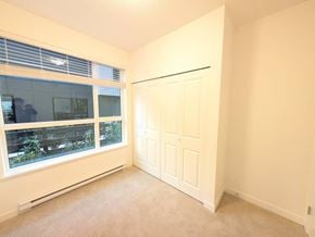 Surrey apartment for rent - A room with a window and a door.