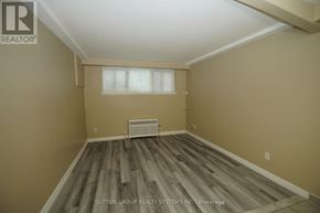 Toronto (Oakwood Village) multi-family for rent - A room with a tiled floor and a window with blinds.