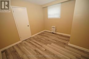 Toronto (Oakwood Village) multi-family for rent - A room with a wood floor and a window.