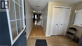 Waterloo townhouse for rent - A hallway with a blue carpet and a white door.