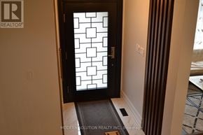 Newmarket (Gorham-College Manor) apartment for rent - A door with a glass window and a black frame.