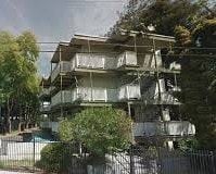 Oakland apartment for rent - A large, multi-level house with a balcony on the upper floor.