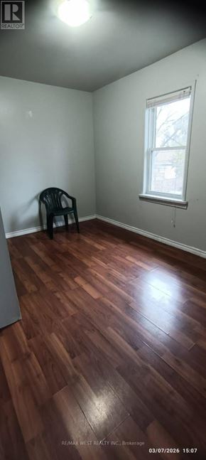 Windsor multi-family for rent - A room with a wooden floor and a window.