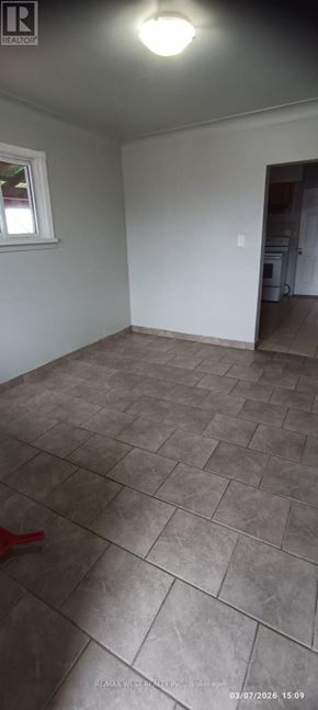 Windsor multi-family for rent - A room with a tile floor and a window.