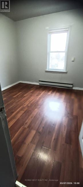 Windsor multi-family for rent - A room with wooden flooring and a window.