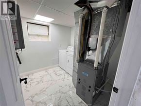 Tecumseh apartment for rent - A room with a washer and dryer in it.