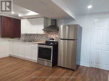 Richmond Hill (North Richvale) apartment for rent - A kitchen with a stainless steel refrigerator and oven.