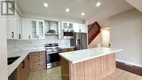 Markham (Cornell) apartment for rent - A modern kitchen with a center island and stainless steel appliances.