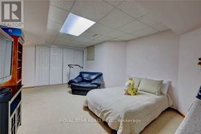 Mississauga (Hurontario) apartment for rent - A bedroom with a bed, a chair, and a teddy bear on the bed.