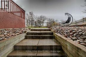 Mississauga (Hurontario) apartment for rent - A set of steps with a rocky surface leading up to a metal sculpture.