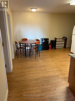 Waterloo condo for rent - A room with a table and chairs in it.