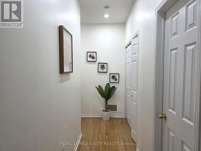Mississauga (Churchill Meadows) townhouse for rent - A hallway with a plant and pictures on the wall.