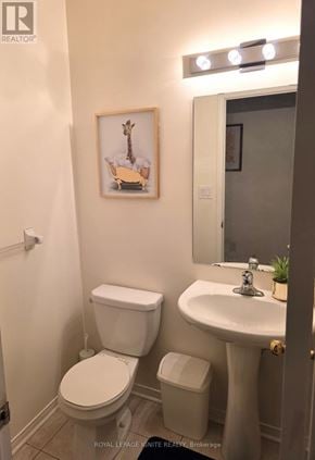 Mississauga (Churchill Meadows) townhouse for rent - A white toilet and sink in a small bathroom.