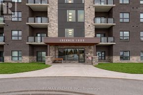 Kitchener condo for rent - The front of a building with the name Lackner 1000 on it.