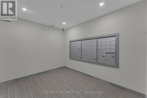 Kitchener condo for rent - A room with a calendar on the wall and a logo of REALTOR® on the top left.