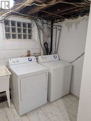 Toronto (Newtonbrook West) apartment for rent - A white washing machine and dryer in a small room.
