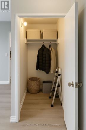 Toronto (Woburn) condo for rent - A balcony with a chair, table and potted plant.
