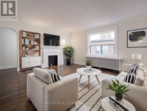 Toronto (Birchcliffe-Cliffside) condo for rent - A living room with a fireplace and a couch.