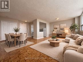 Toronto (Rockcliffe-Smythe) condo for rent - A bedroom with a bed, nightstands, and a window.