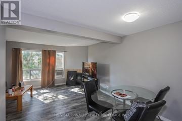 London East (East H) townhouse for rent - A living room with a glass table and chairs.