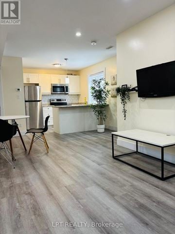 Waterloo apartment for rent - A modern kitchen with a dining table and chairs.