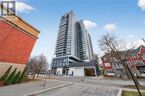 Burlington condo for rent - A tall, modern building stands next to a shorter, older building with a "REALTOR" sign on the top.