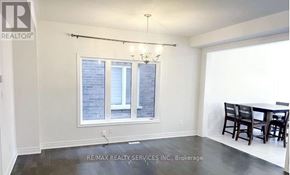 Halton Hills (Georgetown) apartment for rent - A room with a window and a dining table.