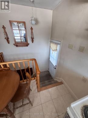 King (King City) apartment for rent - A white wall with two windows and a light fixture.