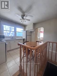 King (King City) apartment for rent - A kitchen with a refrigerator, dishwasher, and a ceiling fan.