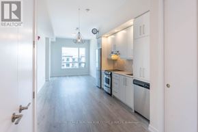 Grimsby (Grimsby Beach) condo for rent - A modern kitchen with white cabinets and stainless steel appliances.