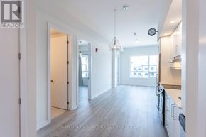 Grimsby (Grimsby Beach) condo for rent - A spacious kitchen with white cabinets and a large island.