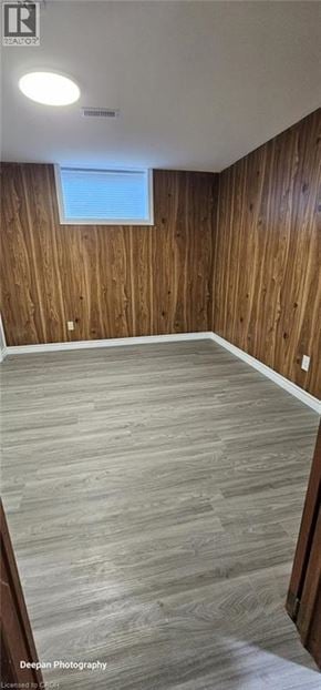 Kitchener apartment for rent - A room with wooden walls and a window.