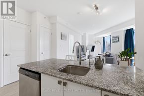 Toronto (Scarborough Village) condo for rent - A kitchen with granite countertops and a sink.