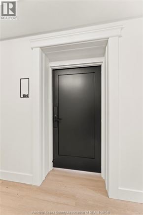 Amherstburg condo for rent - A black door is in a white framed opening.