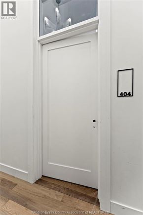 Amherstburg condo for rent - A white door with a number 404 on it.