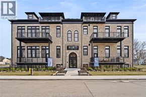 Amherstburg condo for rent - A building with the sign "The Lofts" in front of it.