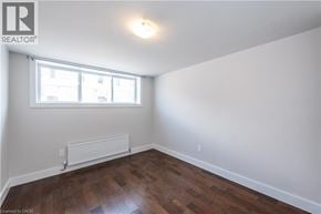 St. Catharines apartment for rent - A room with a window and a radiator on the wall.