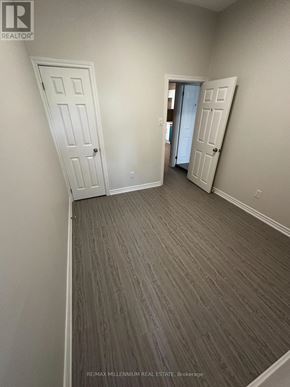 Toronto (North St. James Town) apartment for rent - A room with a grey carpet and two white doors.