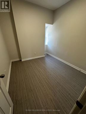 Toronto (North St. James Town) apartment for rent - A room with a wooden floor and white walls.
