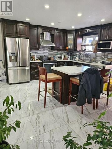 Mississauga (Malton) apartment for rent - A kitchen with a marble floor and a table with chairs.
