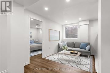 Milton (Fo Ford) apartment for rent - A living room with a grey couch and a coffee table.