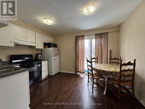 St. Catharines (E. Chester) apartment for rent - A kitchen with a dining table and chairs in the middle of the room.