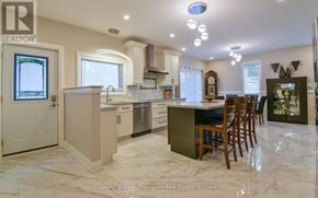 Huntsville (Chaffey) duplex for rent - A kitchen with a marble floor and a wooden chair.