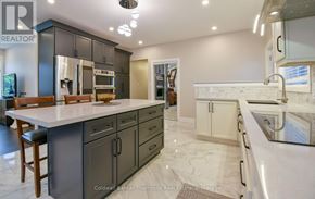 Huntsville (Chaffey) duplex for rent - A modern kitchen with a marble countertop and stainless steel appliances.
