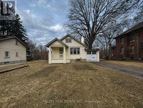 Mississauga (Mineola) multi-family for rent - A white pickup truck is parked in front of a house.