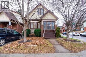 Hamilton apartment for rent - A house with a car parked in front of it.