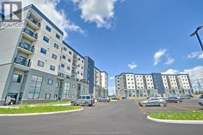 Lasalle condo for rent - A sunny day at a residential complex with cars parked in the lot.