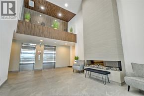 Lasalle condo for rent - A modern living room with a fireplace and a couch.