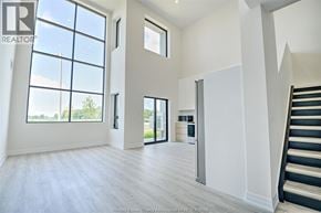 Lasalle condo for rent - A spacious living room with a staircase on the right side.