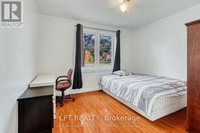Oakville (Co Central) apartment for rent - A bedroom with a bed, desk, and chair.